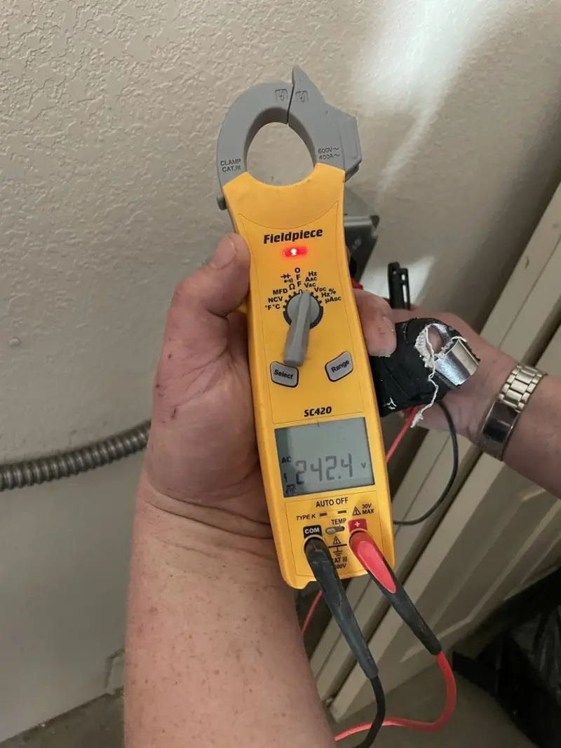 Voltage testing with clamp meter during Circuit Breaker Repair in River Oaks